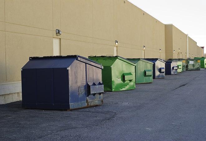 bright yellow construction dumpster full of discarded materials in Aliso Viejo CA